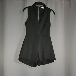 Flirty romper with choker neckline!